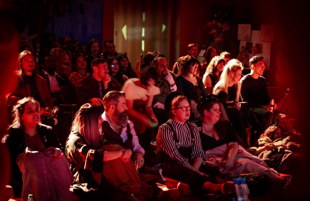 The crowd singing along in costume
